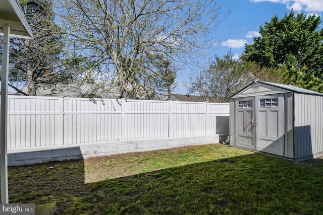 9007 Coastal Hwy, Ocean City, MD 21842 - view of yard with a fenced backyard, a storage unit, and an outdoor structure
