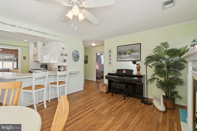 9007 Coastal Hwy, Ocean City, MD 21842 - interior space with crown molding, ceiling fan, light wood-style flooring, baseboards, and visible vents