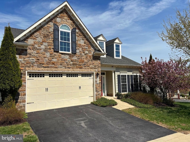 11232 Barnsley Way, Marriottsville, MD 21104 - traditional-style house with an attached garage, a shingled roof, stone siding, and aphalt driveway