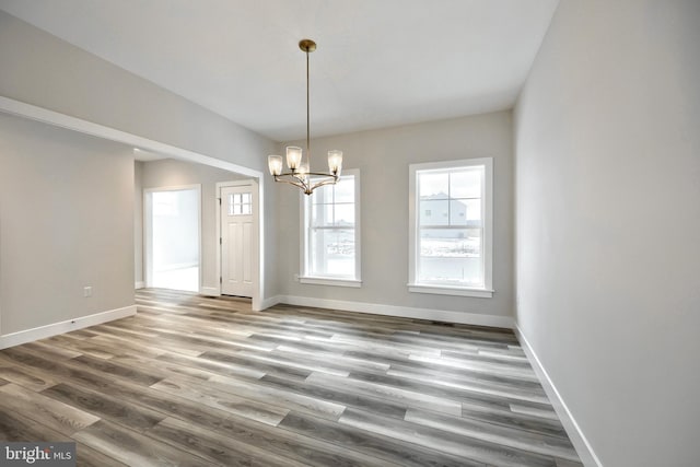 146 Wyndale Dr, Ephrata, PA 17522 - unfurnished dining area featuring baseboards, wood finished floors, and a notable chandelier