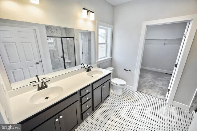 146 Wyndale Dr, Ephrata, PA 17522 - full bathroom with baseboards, toilet, a sink, and a stall shower