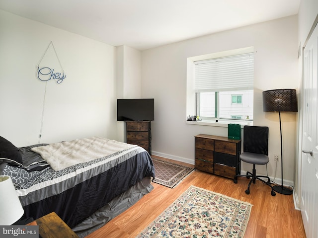 901 N Penn St Unit P506, Philadelphia, PA 19123 - bedroom with baseboards and wood finished floors