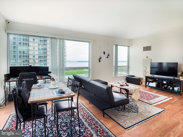 901 N Penn St Unit P506, Philadelphia, PA 19123 - living area featuring visible vents and wood finished floors
