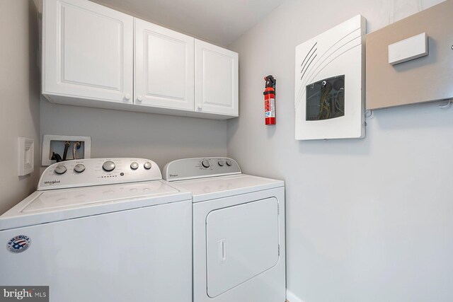 laundry area featuring cabinet space and washer and clothes dryer
