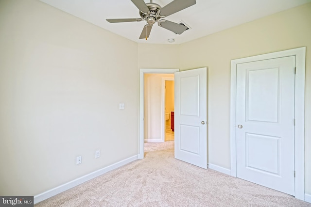 unfurnished bedroom featuring baseboards, carpet flooring, and ceiling fan