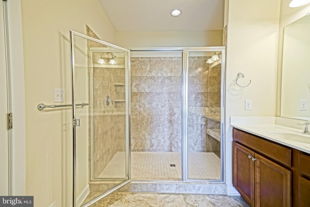 bathroom featuring vanity, recessed lighting, and a shower stall