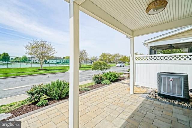 view of patio featuring fence and central AC unit