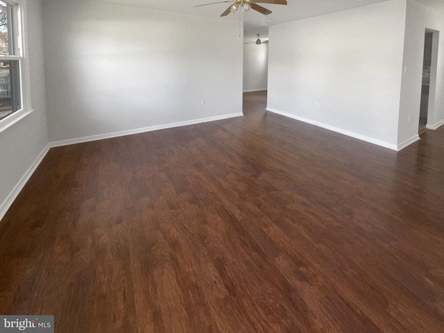 2115 Greenwood Dr, Waldorf, MD 20601 - unfurnished room with baseboards, a ceiling fan, and dark wood-style floors