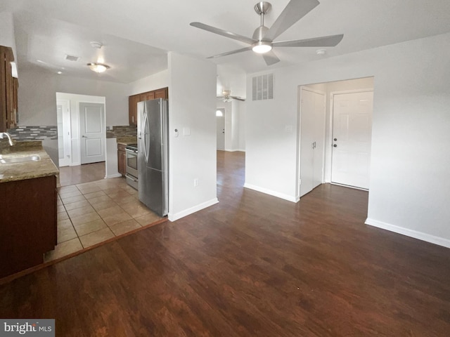 2115 Greenwood Dr, Waldorf, MD 20601 - kitchen with ceiling fan, visible vents, appliances with stainless steel finishes, a sink, and backsplash