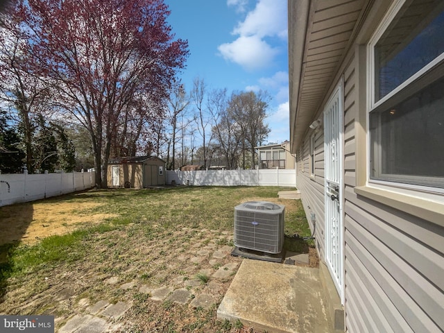 2115 Greenwood Dr, Waldorf, MD 20601 - view of yard with a fenced backyard, central AC, an outdoor structure, and a storage unit