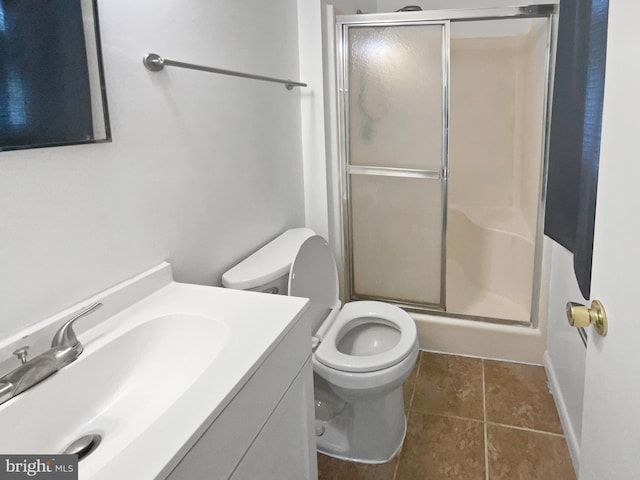 2115 Greenwood Dr, Waldorf, MD 20601 - full bath featuring baseboards, toilet, vanity, tile patterned flooring, and a stall shower