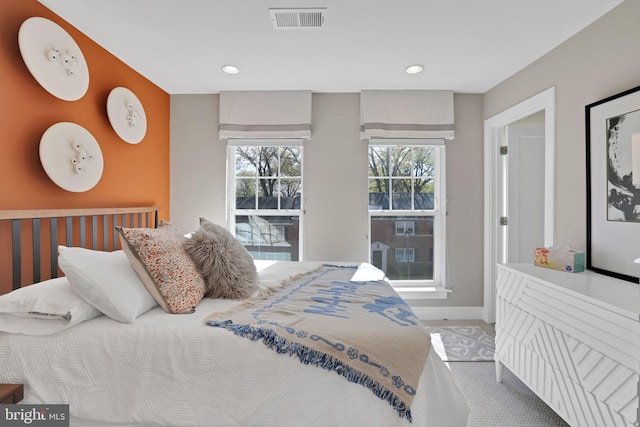 bedroom with baseboards, visible vents, and recessed lighting