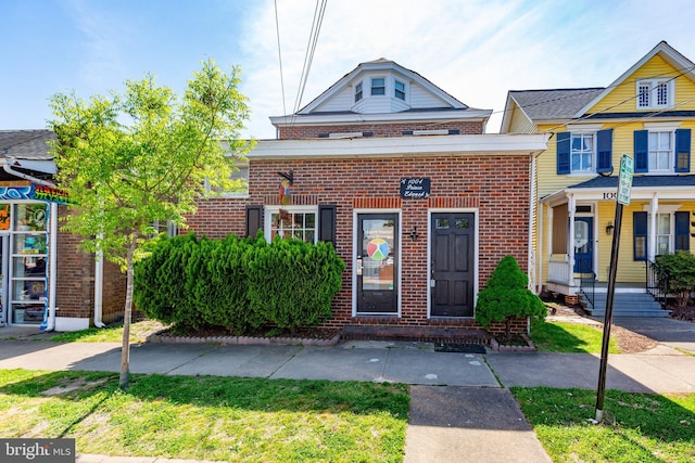 view of front of house with brick siding