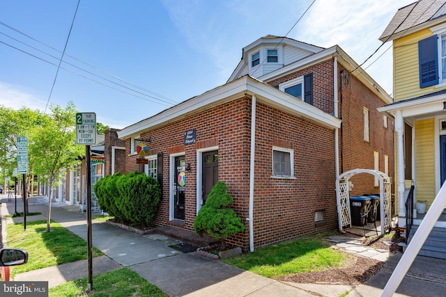 view of front of home featuring brick siding