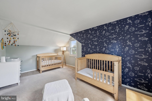 bedroom featuring vaulted ceiling, carpet flooring, and baseboards
