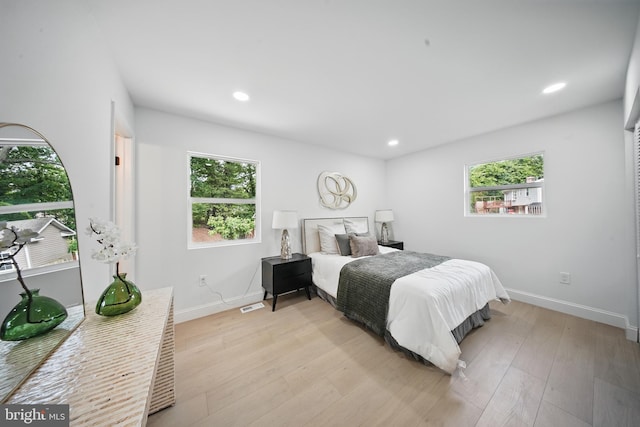 4403 Echo Ct, Woodbridge, VA 22193 - bedroom featuring multiple windows, baseboards, light wood-style floors, and recessed lighting