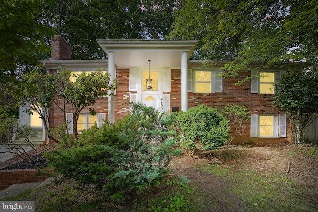 4403 Echo Ct, Woodbridge, VA 22193 - view of front of home featuring brick siding, a chimney, and entry steps
