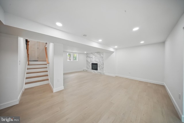 4403 Echo Ct, Woodbridge, VA 22193 - basement with recessed lighting, light wood-type flooring, baseboards, a fireplace, and stairs