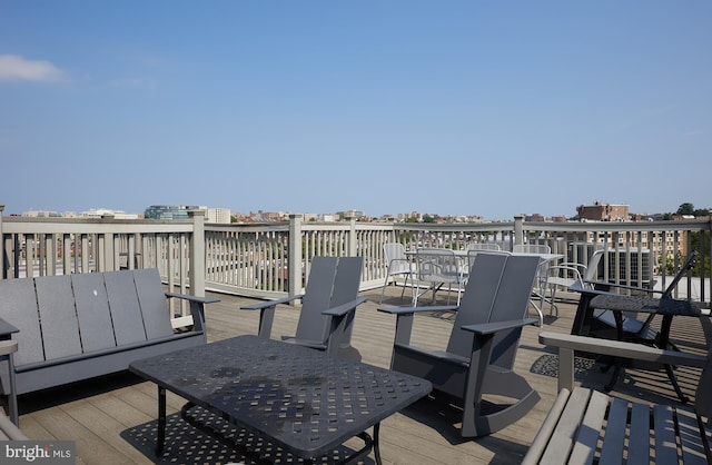 wooden terrace featuring outdoor dining area
