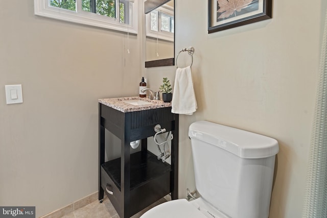bathroom featuring toilet and vanity