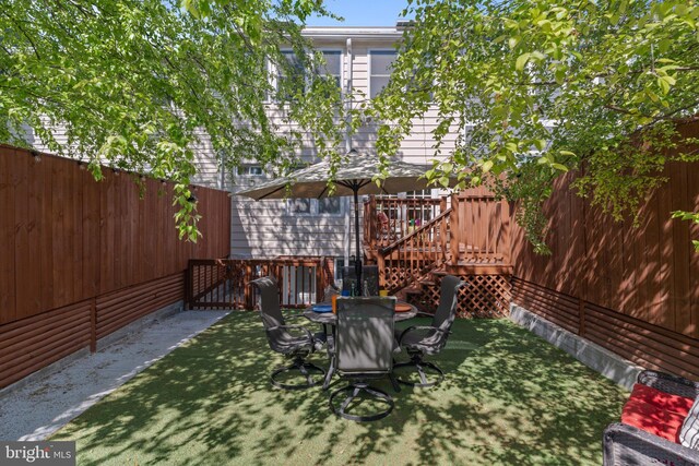 view of yard with a wooden deck