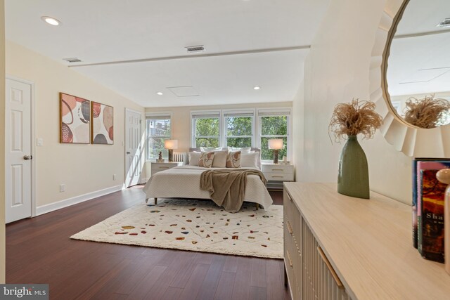 bedroom featuring dark wood-type flooring, baseboards, and recessed lighting