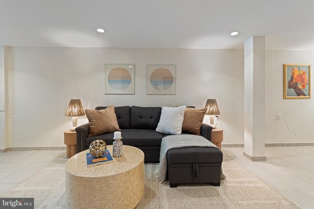 living room with recessed lighting and baseboards