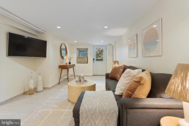 living area featuring recessed lighting and cooling unit
