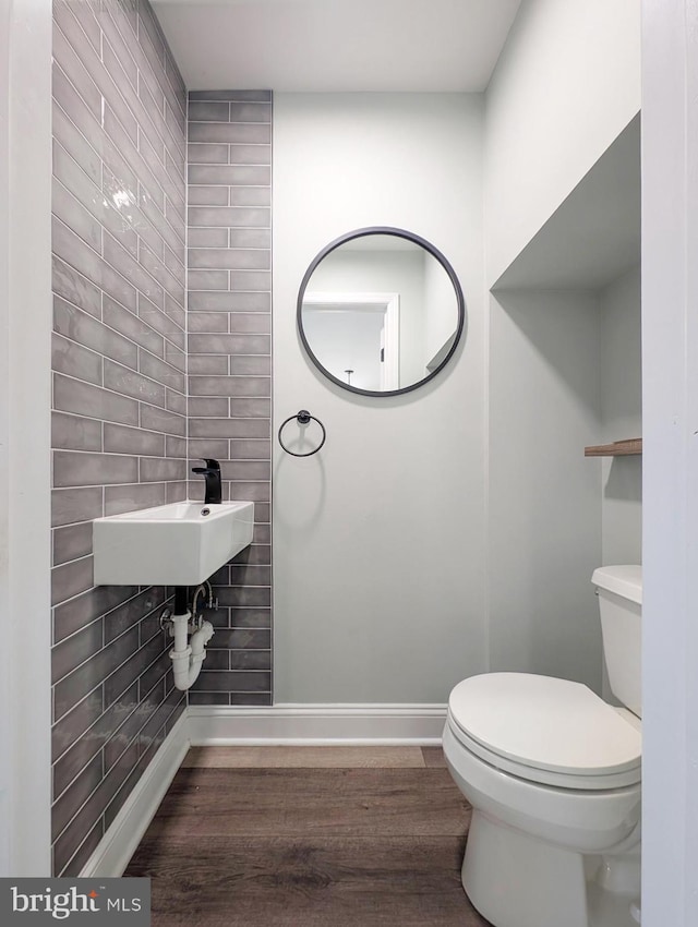 16 S Union St, Lambertville, NJ 08530 - bathroom featuring toilet, wood finished floors, a sink, and baseboards