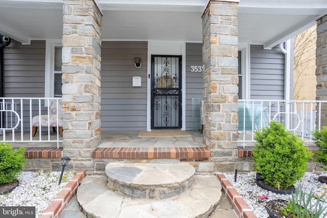 doorway to property featuring a porch
