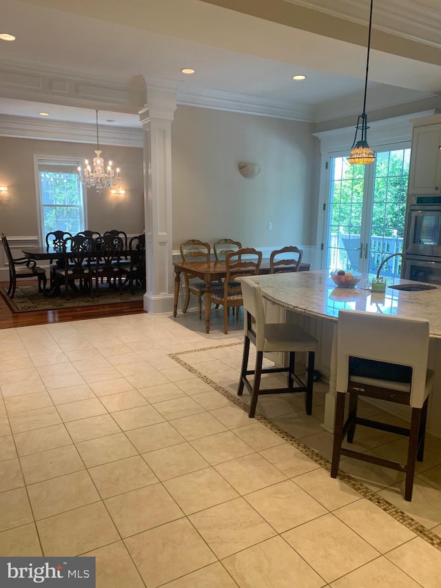 dining room with light tile patterned floors, recessed lighting, a notable chandelier, and ornamental molding
