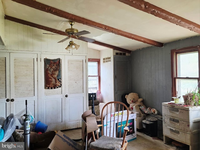 interior space featuring visible vents and beam ceiling