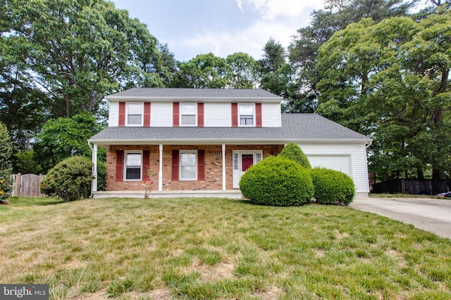 500 Kegworth Ct, Severna Park, MD 21146 - traditional-style house featuring a garage, a front yard, fence, brick siding, and driveway
