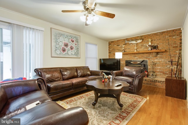 500 Kegworth Ct, Severna Park, MD 21146 - living area with crown molding, brick wall, wood finished floors, and a ceiling fan