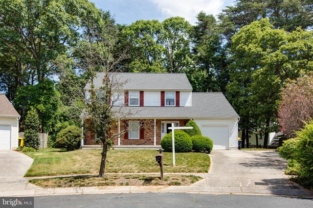 500 Kegworth Ct, Severna Park, MD 21146 - traditional-style house featuring driveway, an attached garage, a front lawn, brick siding, and fence