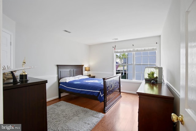 bedroom with wood finished floors