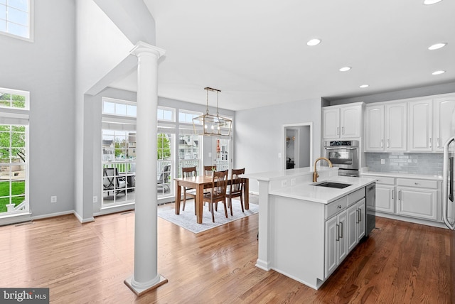 kitchen featuring a sink, appliances with stainless steel finishes, plenty of natural light, and recessed lighting