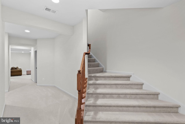 stairs with recessed lighting, baseboards, visible vents, and carpet