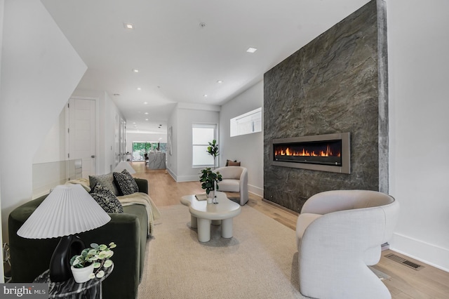 2515 Ontario Rd NW Unit 1, Washington, DC 20009 - living area with wood finished floors, a large fireplace, baseboards, and recessed lighting
