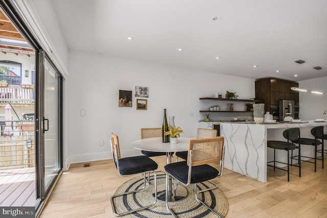 2515 Ontario Rd NW Unit 1, Washington, DC 20009 - dining room featuring light wood-type flooring and baseboards