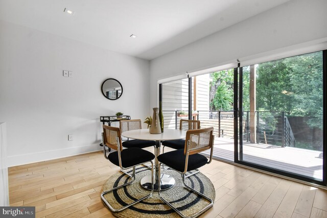 2515 Ontario Rd NW Unit 1, Washington, DC 20009 - dining area with plenty of natural light, light wood-style floors, and baseboards