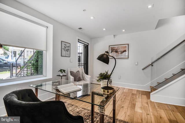 2515 Ontario Rd NW Unit 1, Washington, DC 20009 - living area with baseboards, wood finished floors, recessed lighting, and stairway