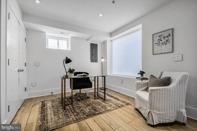 2515 Ontario Rd NW Unit 1, Washington, DC 20009 - office featuring electric panel, wood finished floors, and baseboards