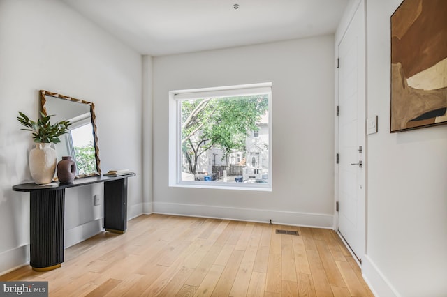 2515 Ontario Rd NW Unit 1, Washington, DC 20009 - entrance foyer with light wood-style flooring and baseboards