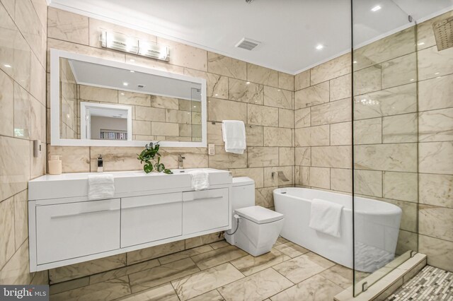 2515 Ontario Rd NW Unit 1, Washington, DC 20009 - full bathroom featuring tile walls, double vanity, marble finish floors, ornamental molding, and walk in shower