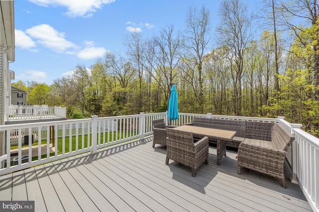 wooden deck featuring outdoor dining space