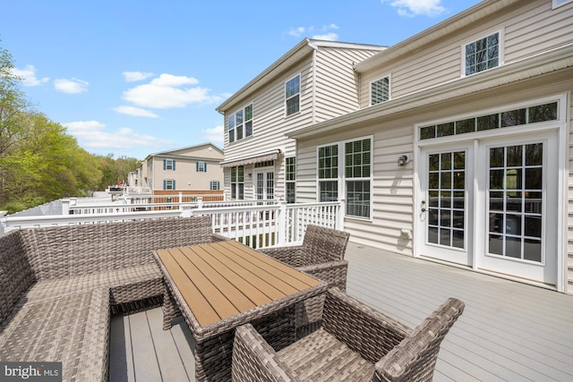 deck featuring outdoor dining area