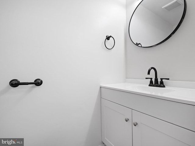 bathroom featuring vanity and visible vents