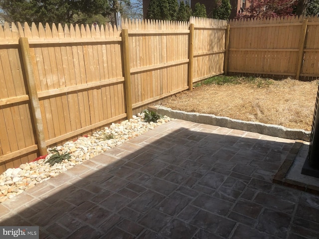 view of patio with a fenced backyard