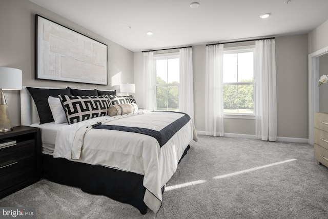 carpeted bedroom with baseboards and recessed lighting